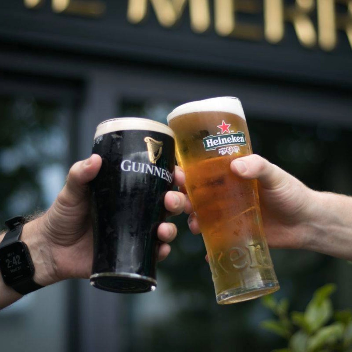 image of a pint of heineken and guinness